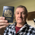 Picture of client with new British Passport in hand