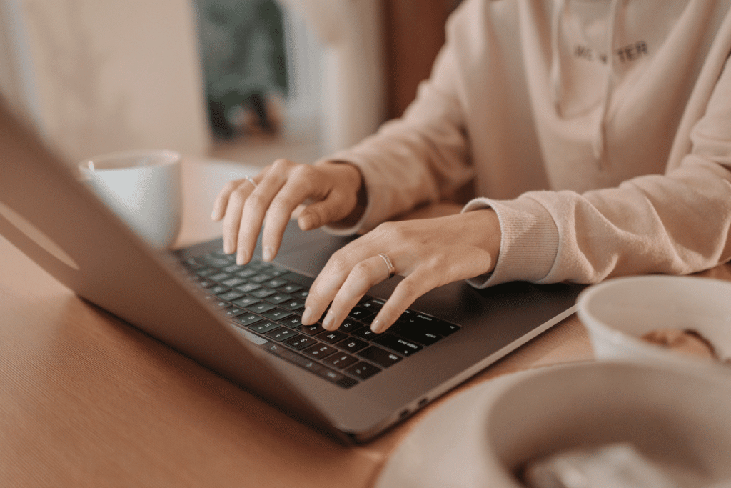 woman on laptop searching for british passport renewal requirements