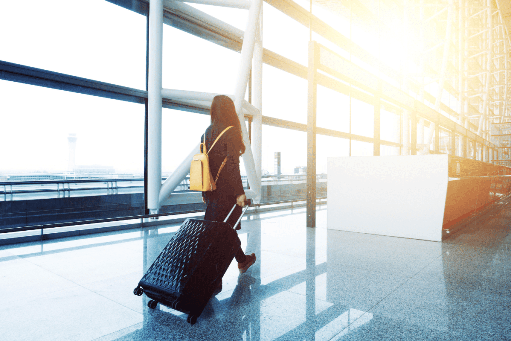 person at airport traveling with UK passport