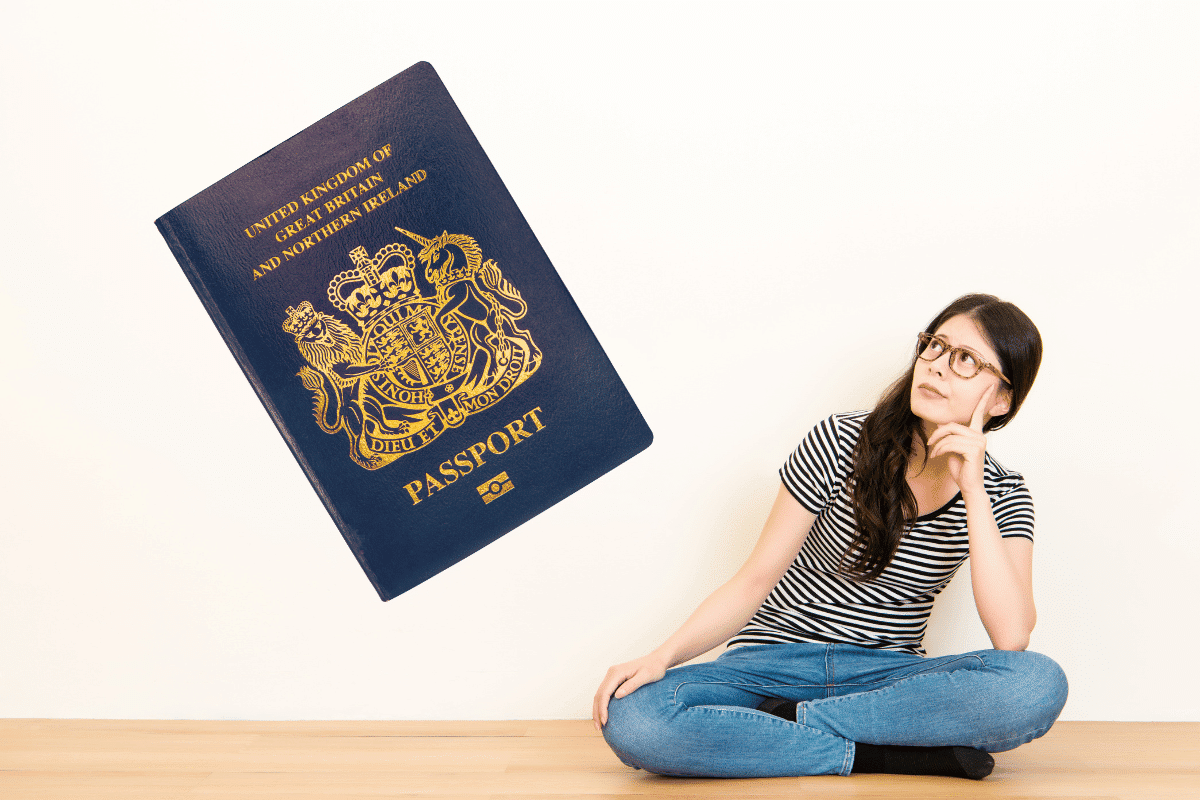 person asking question with UK passport in background